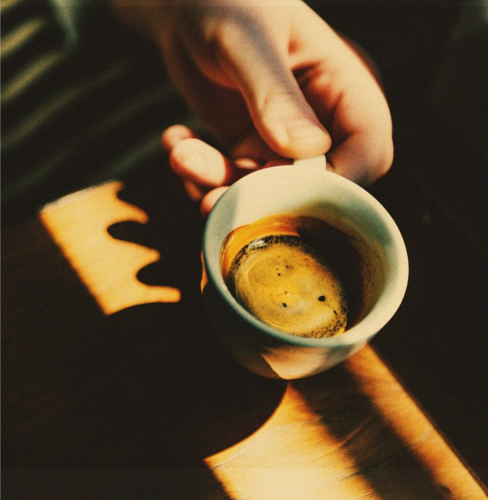 A closeup of an espresso cup with coffee in it