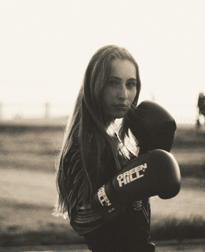 A woman with boxing gloves