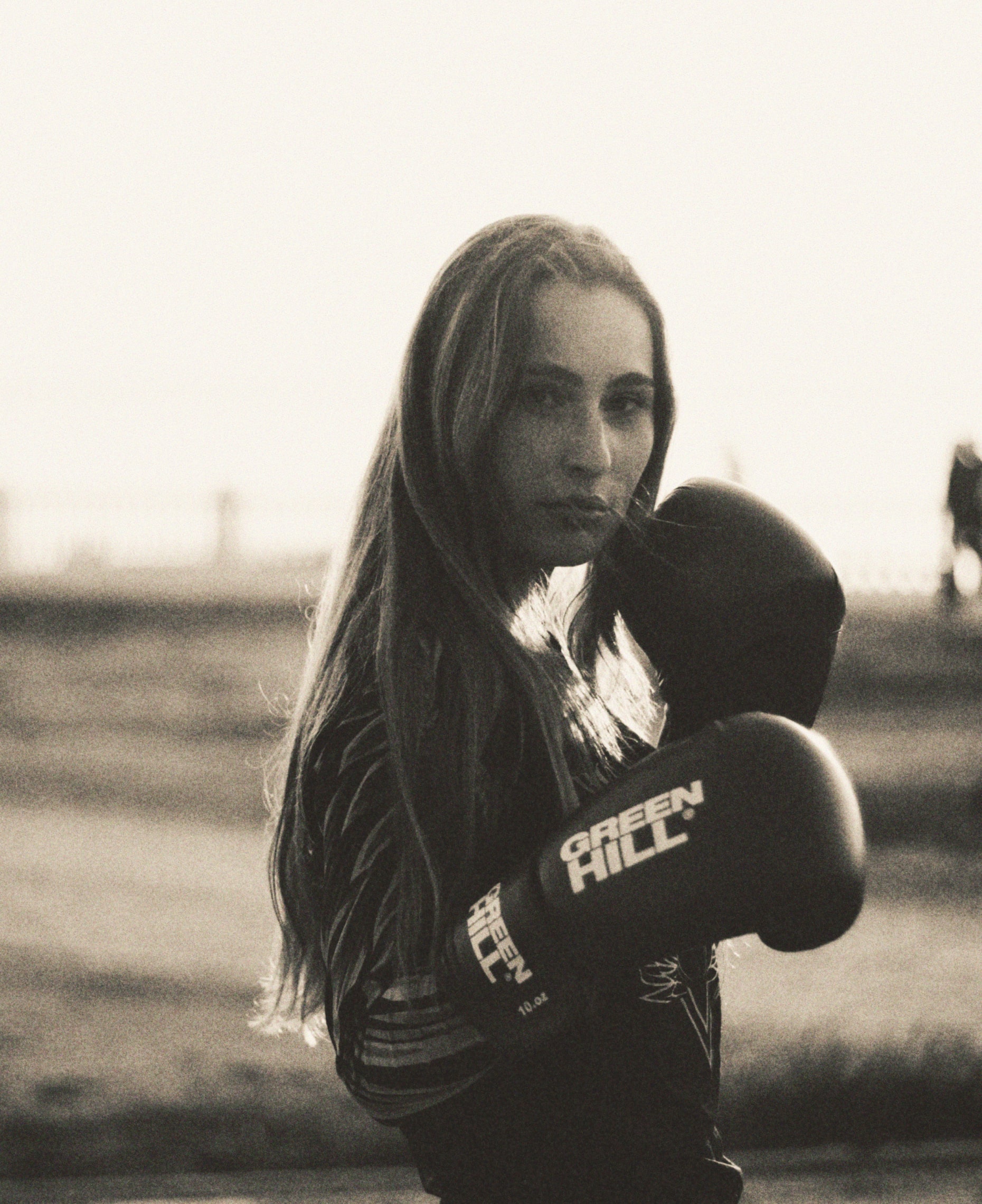 A woman with boxing gloves